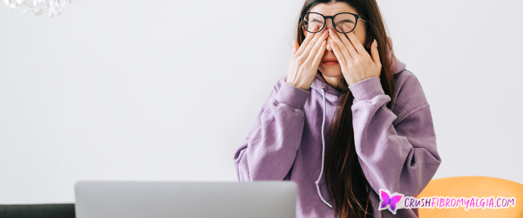 Woman rubbing her eyes from eye pain