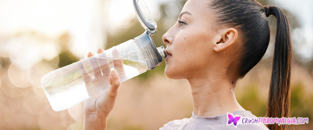 Woman hydrating with water
